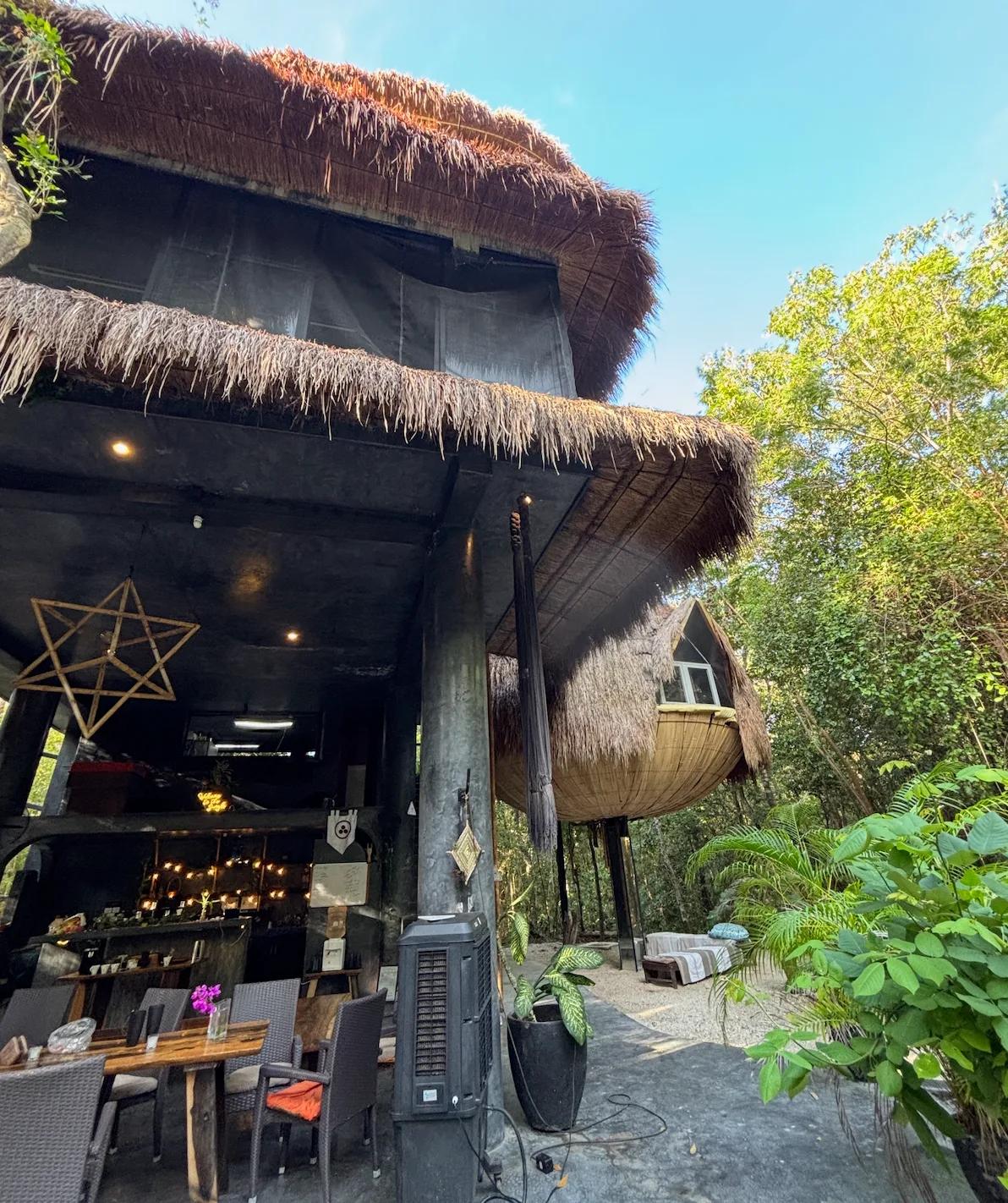 The thatched-roof main building at the Ekumal retreat center